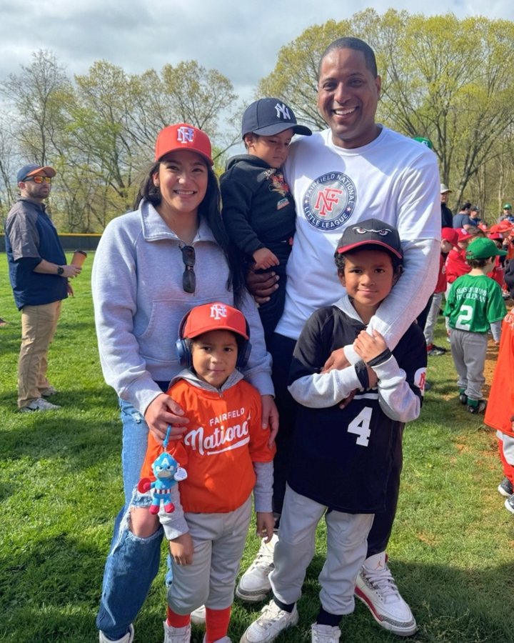 Fatima and Kevin with their three boys at the ballpark